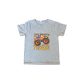 Boys Truck T Shirt featuring a fun design that says 'Easily Distracted by Trucks' in colorful graphics.