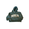 Boys Brooklyn Hoodie in green, featuring 'BROOKLYN NEW YORK' text, stylish and warm casual pullover for kids.